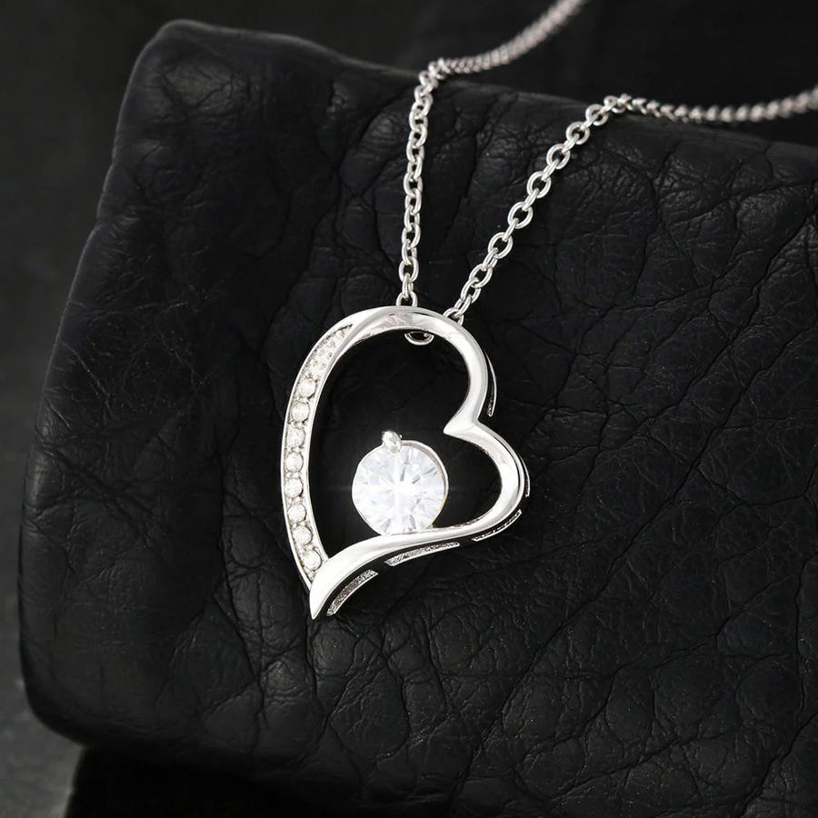 Forever-heart necklace on a black textile background